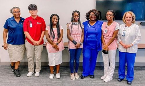 MUSC Florence teen volunteers at the VolunTEEN end of program luncheon. Pictured with the department's directors.