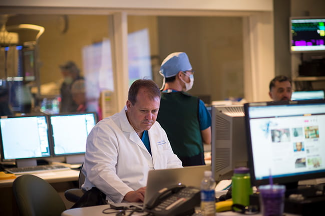 Dr. Aquilla Turk (front left) in the angiography suite