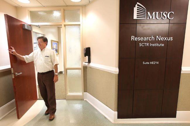 Researcher stands in front of SCTR’s Nexus Research Center