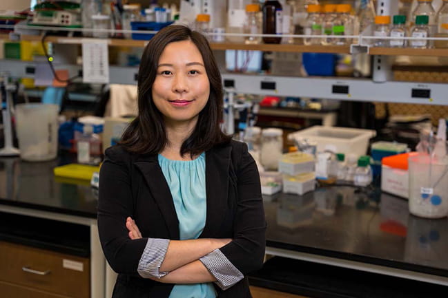 Dr. Lu Han poses in her lab