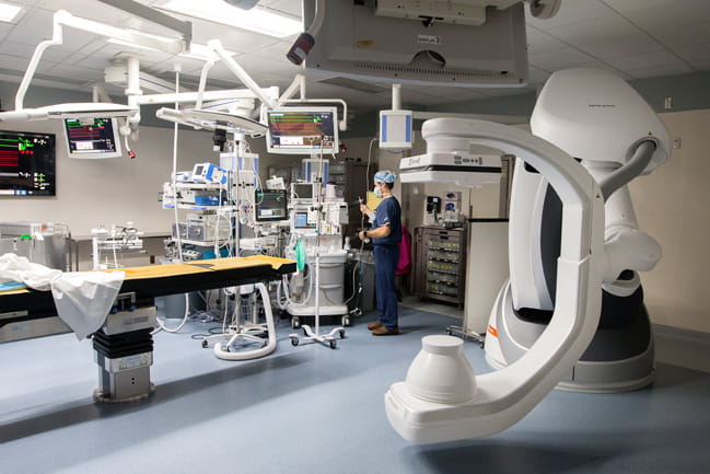 Brady Thomas works in the new operating room.